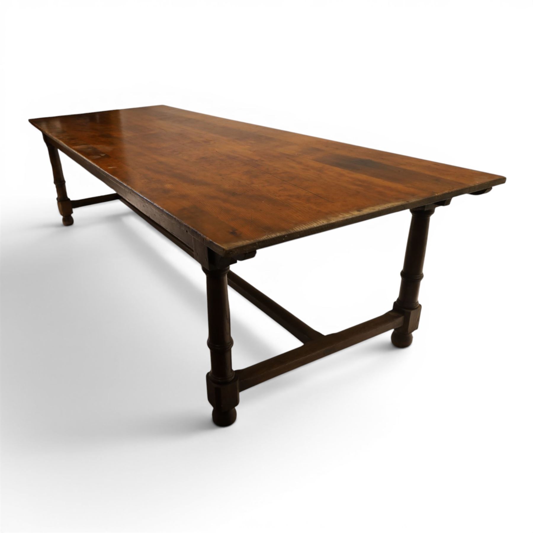 Large oak and pine farmhouse table, with pine plank top raised on and oak base with turned supports united by a long stretcher 