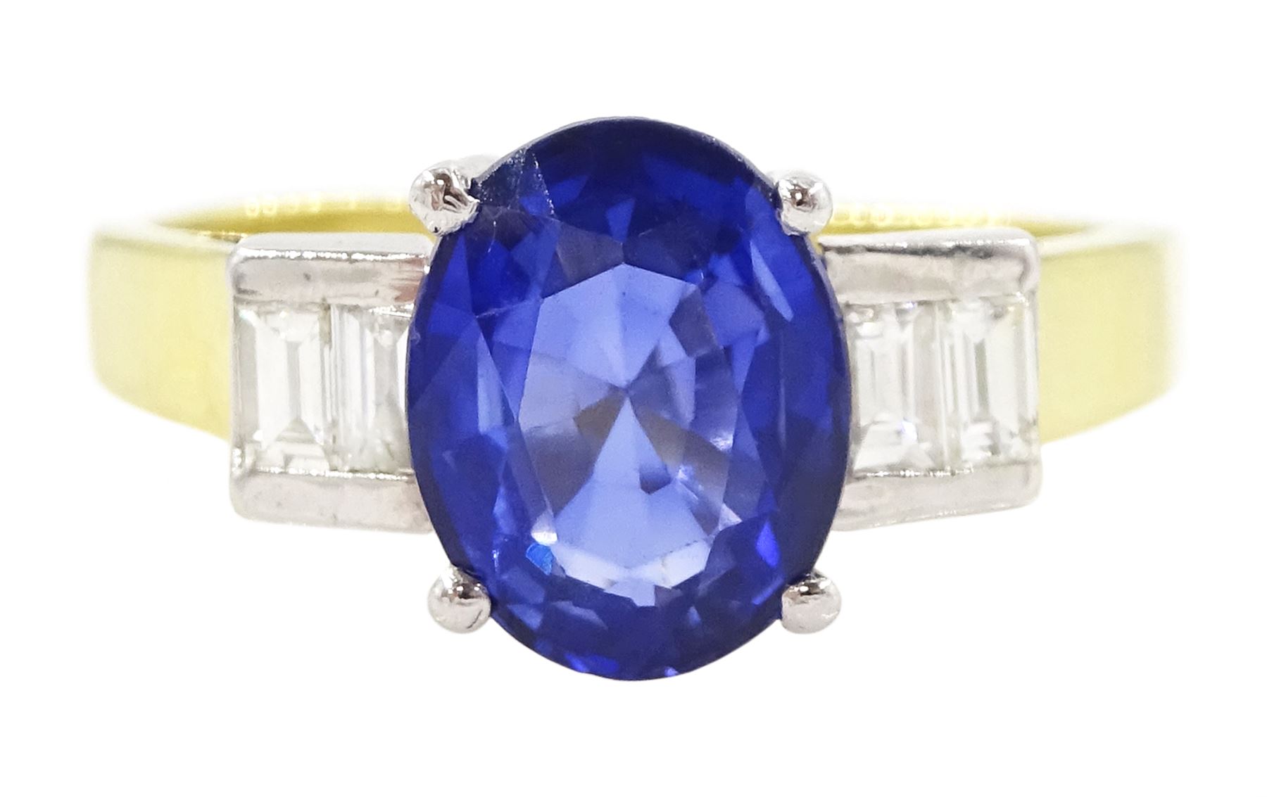 18ct gold tanzanite and diamond ring, single stone oval cut tanzanite of approx 1.75 carat, with two baguette cut diamonds set either side, stamped 750