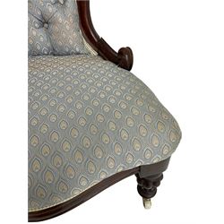 Victorian walnut framed open armchair, scrolled arm terminals over spiral turned arm supports, upholstered in foliate patterned fabric with sprung seat, on turned supports and brass castors (W65cm H92cm); and Victorian mahogany nursing chair with lobe carved supports (W60cm H92cm)