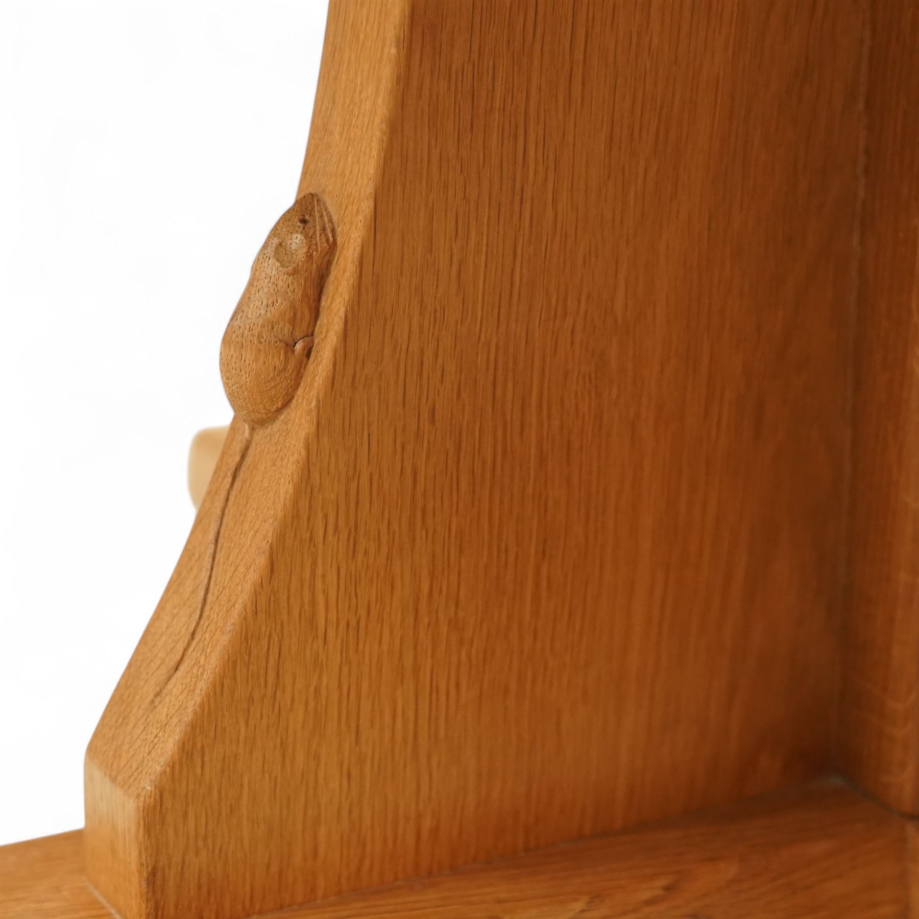 Mouseman - adzed oak octagonal concave dining table, raised on cruciform base, the supports and sledge feet also adzed, carved with fat mouse signature, by the workshop of Robert Thompson, Kilburn