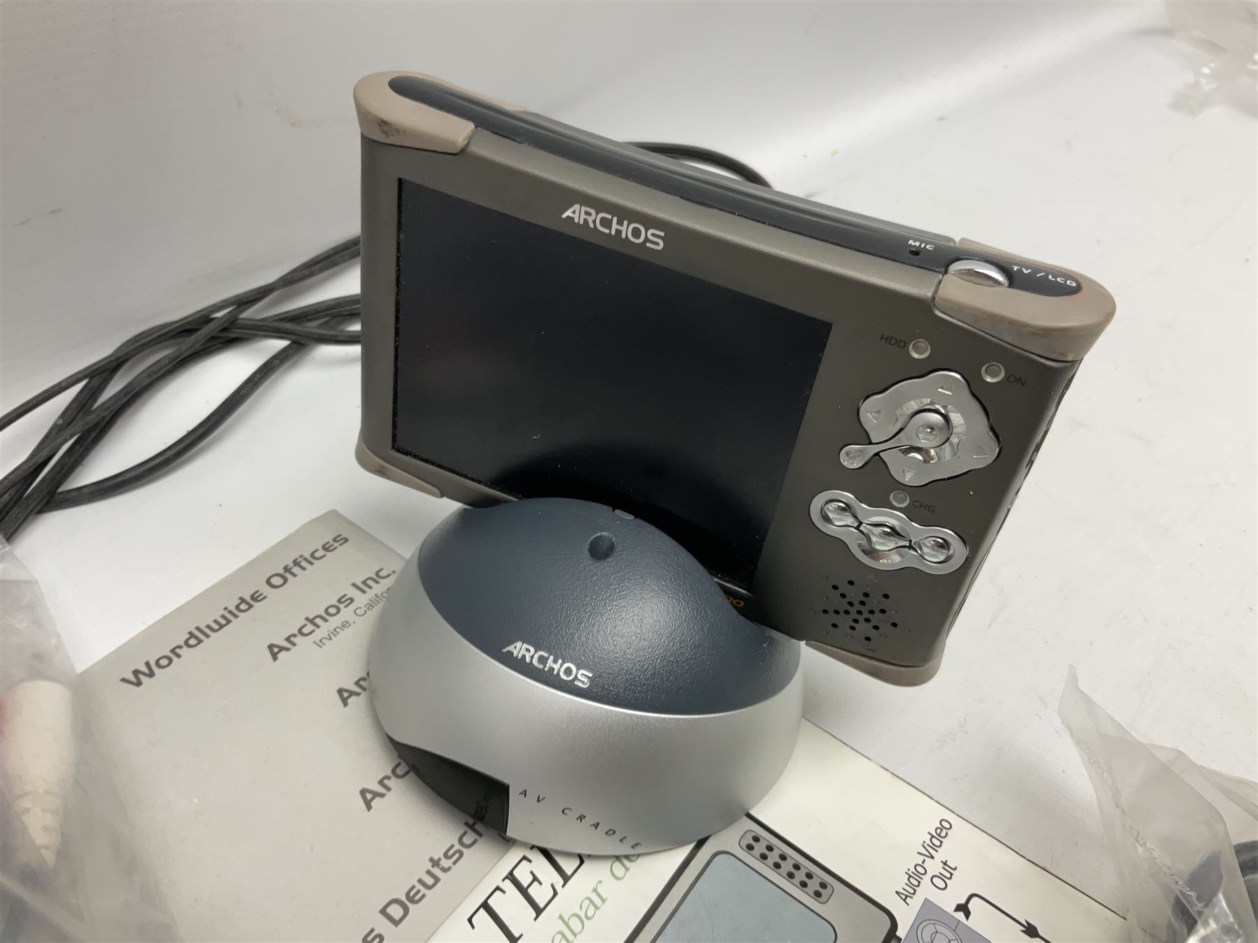 Nintendo Wii console, four controllers with cases and four nunchucks, Wii sensor bar, balance board and dance mat. Guitar hero wireless guitar for Wii and Redoctane wired guitar. Nintendo DS lite handheld gaming console, console and game cases and Guitar Hero Redoctane Guitar Grip. Selection of Nintendo Wii and Nintendo DS lite games to include Super Mario Galaxy, Guitar Hero, Wii Fit, Legend of Zelda games etc. Archos AV400 Series pocket video recorder with accessories, cradle and remote, in three boxes