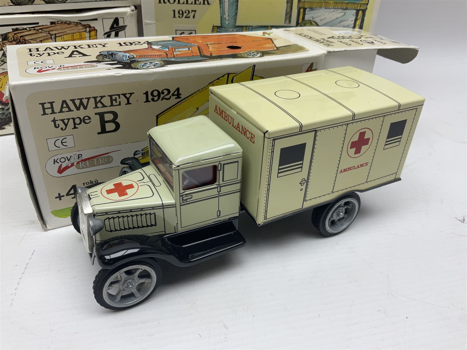 Kovap - eleven tinplate models to include Tractor and Trailer, Road Roller 1927, Moving Moneybox 1924, Hawkeye type B 1924, Boy on a Tricycle; all in original boxes 