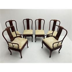 Mid to late 20th century Chinese hardwood extending dining table, two additional leaves, shaped apron carved with foliate scrolls, leaf carved cabriole supports (W246cm, H78cm, D117cm), and set six (4+2) dining chairs with shaped cresting rails over carved splats