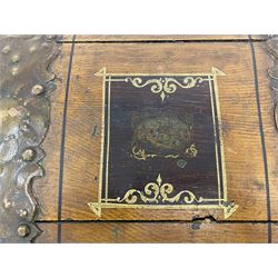 19th century painted oak sea chest, hinged dome top enclosing small compartment, bound by shaped and pressed metal strapwork, scumbled finish to resemble oak and painted with small vignettes depicting portraits and landscapes within panels, fitted with large wrought metal carrying handles, the front inscribed 'H.J.S. 1870' 