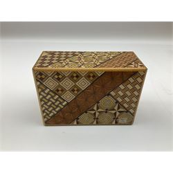 Japanese parquetry puzzle box L12cm; another Japanese puzzle box with marquetry top of Mount Fuji; eleven graduated Chinese figures including immortals; and Chinese figure of a lady standing on a hardwood base next to a horn table (14)