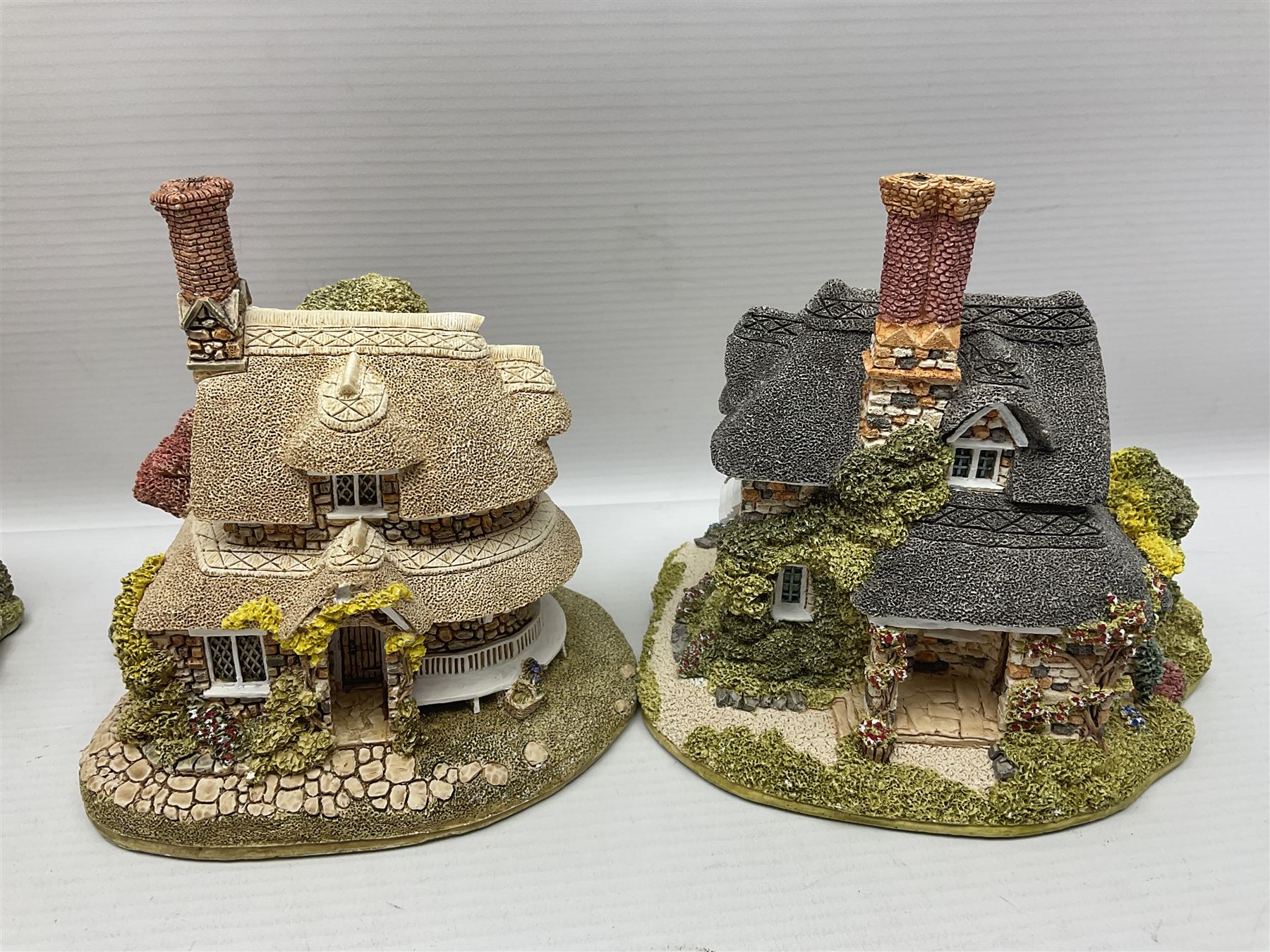 Eight Lilliput Lane limited edition Beatrix Potter models, including Buckle Yeat, Tabitha Twitchits Shop and Ginger Pickles Shop, together with twelve Lilliput Lane models from the Blaise Hamlet collection, including Dial Cottage, Diamond Cottage and Vine Cottage, all with deeds and original boxes (20)