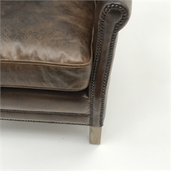  Club armchair upholstered in antique brown leather with low shaped back, W67cm, H74cm, D72cm  