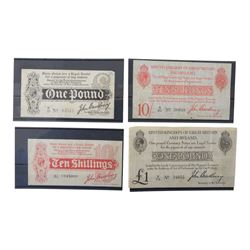 Four King George V Bradbury banknotes, comprising first issue ten shillings, second issue ...