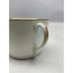 WW2 Nymphenburg cups and saucer, decorated with Imperial German Iron Cross encircled in a foliate boarder with gilt edging, with printed mark beneath 