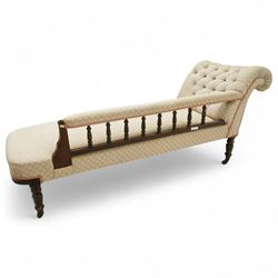 Late 19th century cream upholstered chaise longue, patterned pale damask fabric, padded arm with spindle back gallery raised on turned legs upon castors