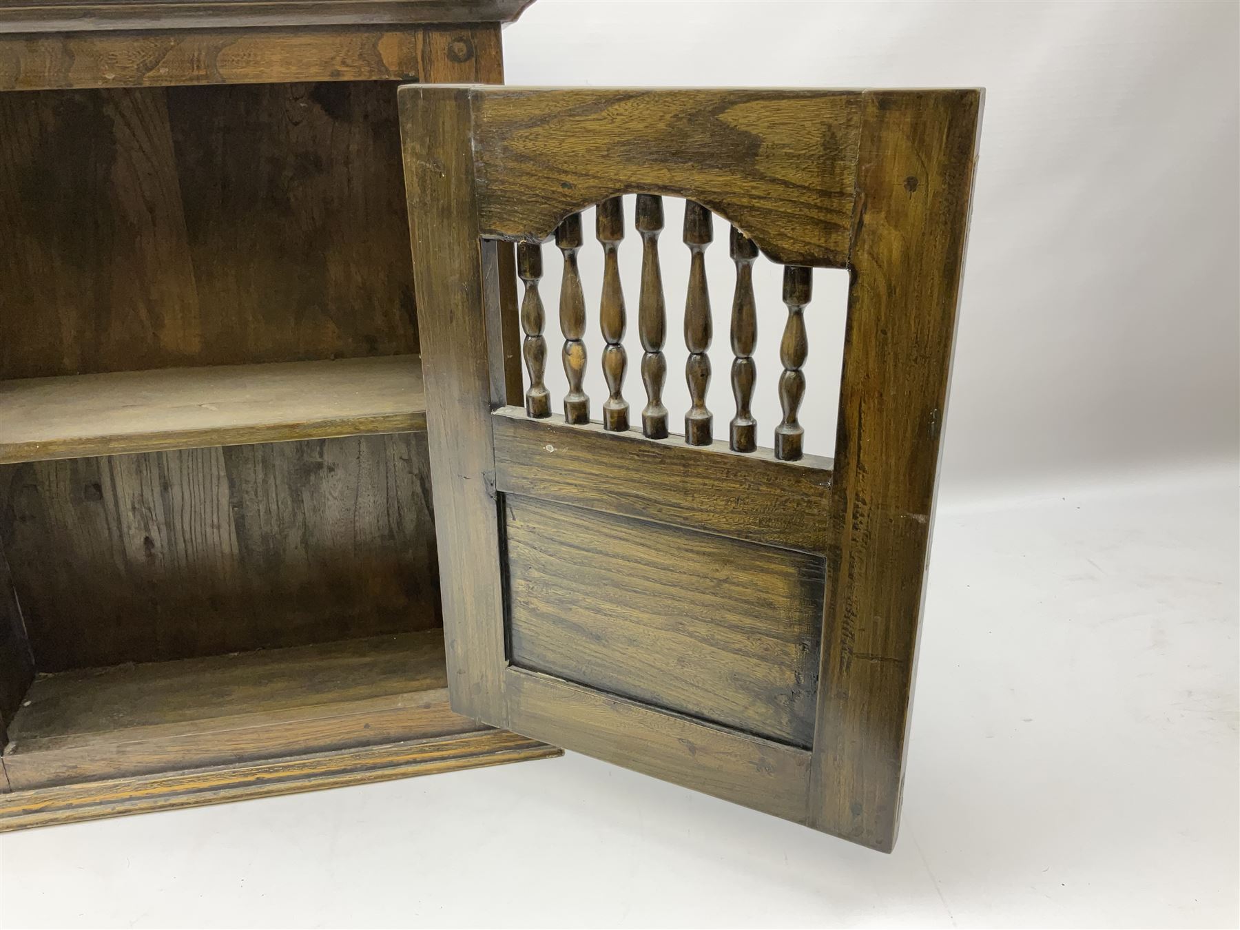 Oak dole cupboard / food hutch, the hinged panelled door with turned spindles enclosing a single shelf interior, H52cm D17cm W46cm