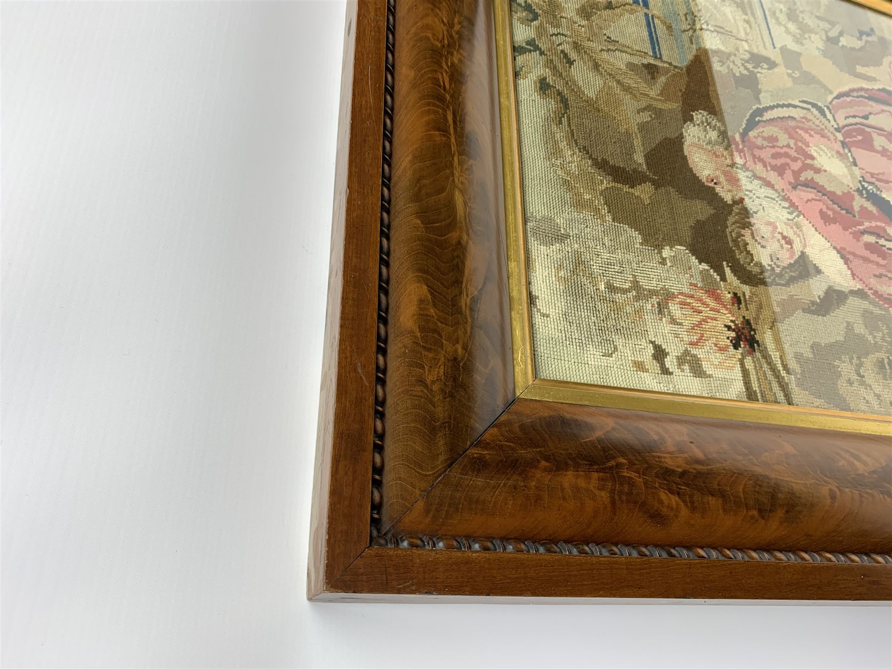 FRAMES - Victorian figured mahogany frame, with egg and dart edging and a gilt slip, containing a Berlin woolwork picture depicting Abraham and Isaac, H78cm W69.5cm