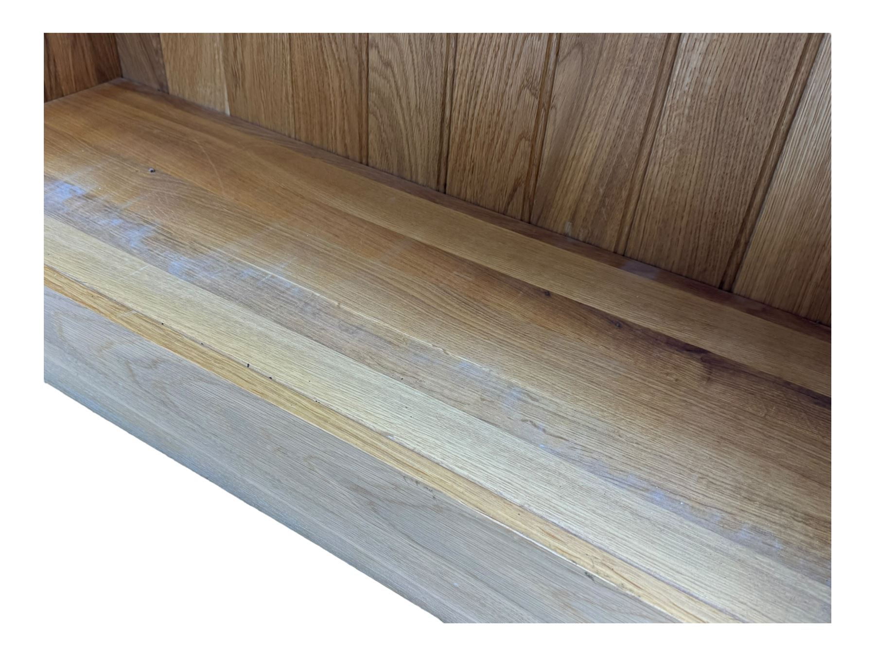 Contemporary light oak open bookcase, rectangular form with projecting top, fitted with five adjustable shelves, on a straight plinth base