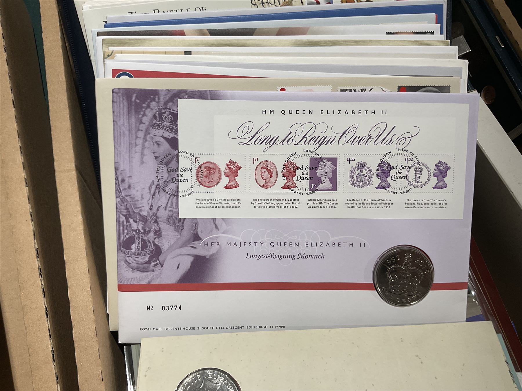 Approximately one hundred and fifteen Royal Mint coin covers, in two ring binder folders and loose, together with approximately 53 grams of Great British pre-1920 and approximately 68 grams of Great British pre-1947 silver threepence coins, and a small quantity of further pre-decimal coins