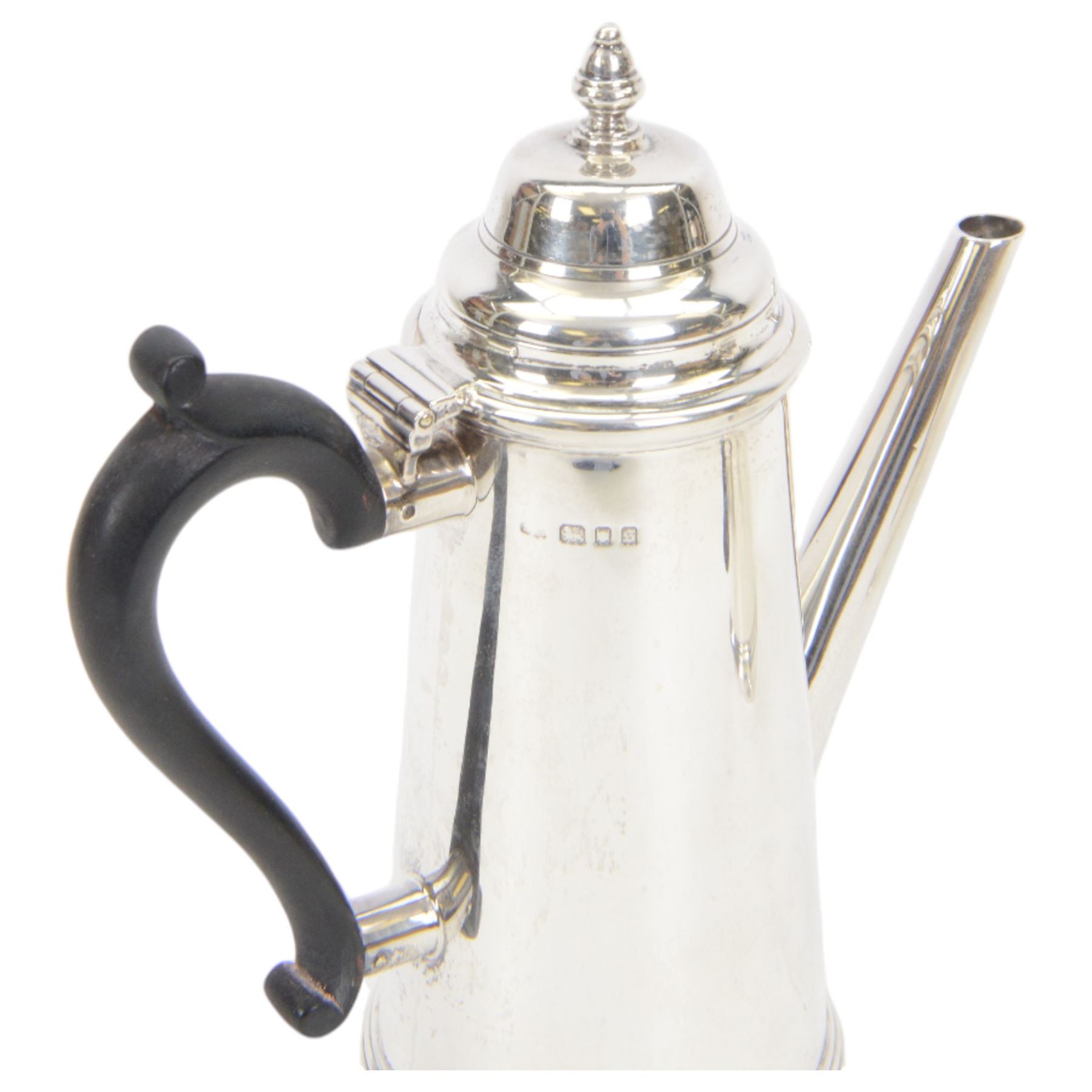 1930's silver two piece cafe au lait set, comprising coffee pot and a hot milk jug, each of tapered cylindrical form, with ebonised handles, hallmarked Nayler Brothers, London 1933, H19cm