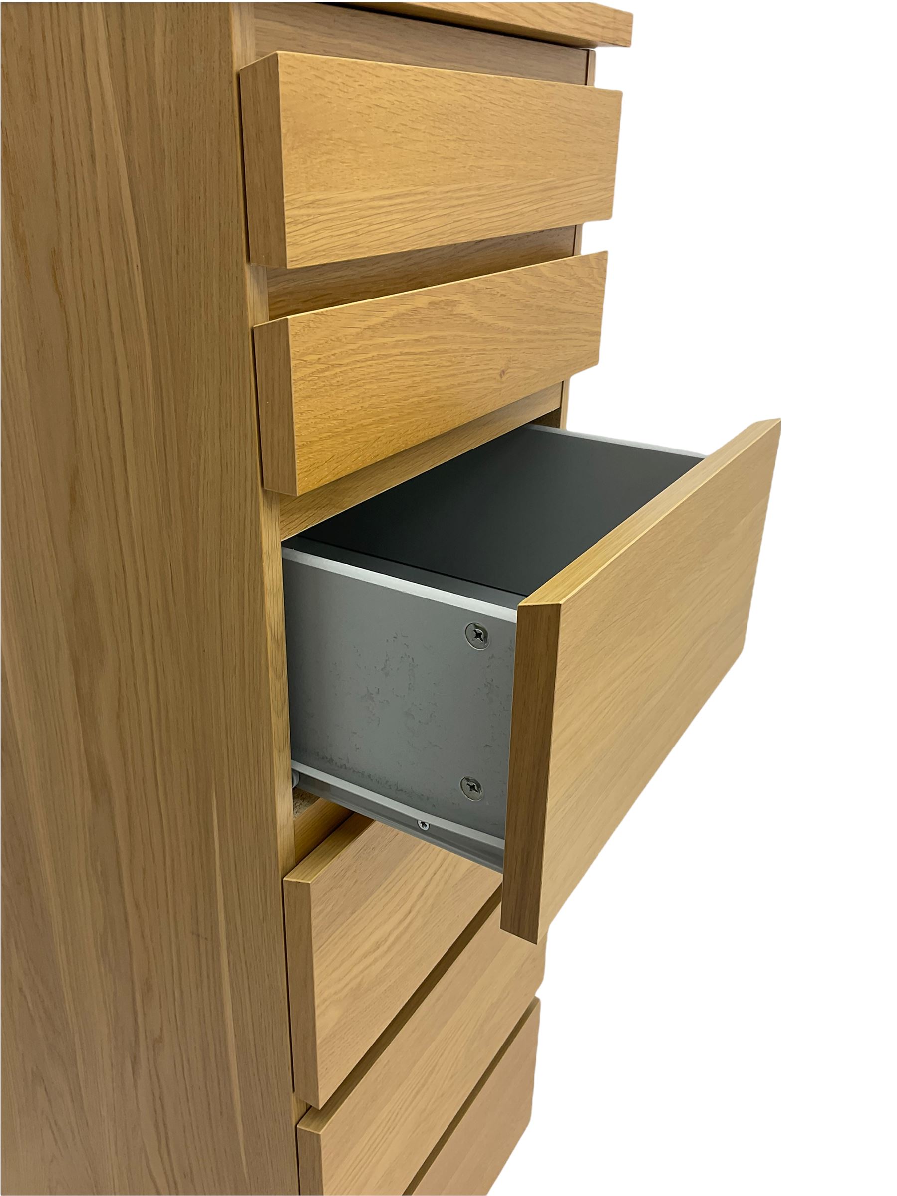 IKEA light oak finish chest, fitted with hinged vanity top, above six graduating drawers 