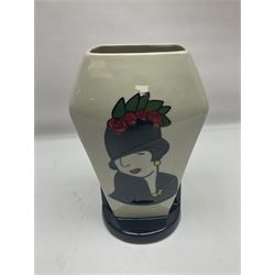 Charlotte Rhead for Crown Ducal ceramics, comprising coffin shaped vase depicting a woman in 1920s dress, a vase with handle, decorated with autumn leaves and a bowl, decorated with flowers and berries, with printed and signed marks beneath, coffin vase H24cm