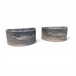 Pair of 19th century decorative lead planters of demi-lune form, decorated with raised rel...