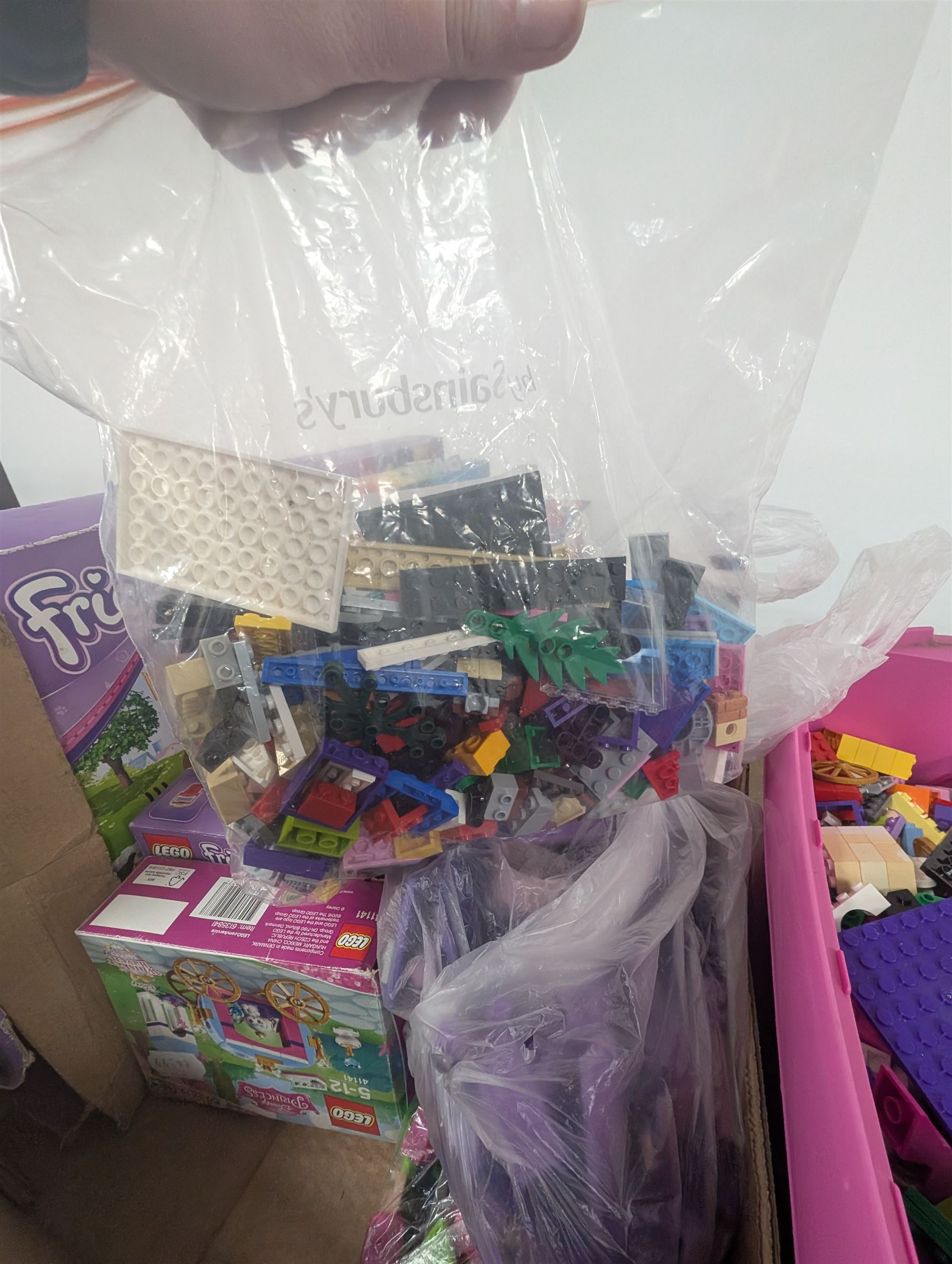 Lego Friends no. 3189 Stables set, Lego Trolls no. 41252 World Tour set, The Lego Movie set no. 70825, three small Lego Friends sets, all boxed and a quantity of loose Lego, including purple and pink colourways