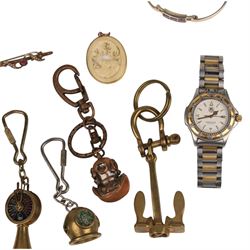 9ct gold jewellery, including bone deer pendant in gold mount, signet ring and stone set brooch, all stamped or hallmarked, three silver bangles, base metal bangle, brass diving related keychains and a Tag Heuer quartz wristwatch
