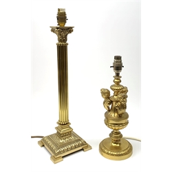 Two gilt table lamps, comprising one modelled as a Corinthian column, H49cm, the other with putti bust detail to the stem, H34cm. 