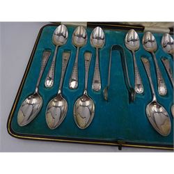 Set of twelve Edwardian silver teaspoons and a pair of matching sugar tongs, with engraved scrolling pattern to handles, hallmarked John Sanderson, Sheffield 1908, contained within a tooled leather silk and velvet lined fitted case