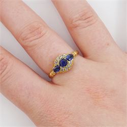 Early 20th century 18ct gold three stone oval cut sapphire and eight stone diamond cluster ring, Chester 1916