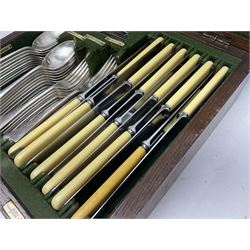 Walker and Hall silver plated canteen of cutlery, oak case, the hinged lid with a engraved brass shield , H12cm, L32cm