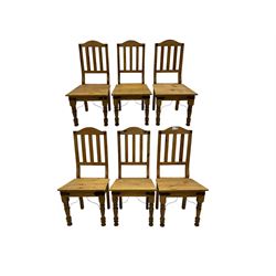Set of six waxed pine dining chairs, shaped cresting over vertical slat back, plank seat on turned front supports 