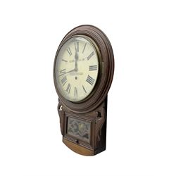 Richard Smith & Son, Scarborough - drop dial 8-day mahogany wall clock, with a turned wooden bezel, carved ear pieces and pendulum box with a glazed door and open carved fretwork,12