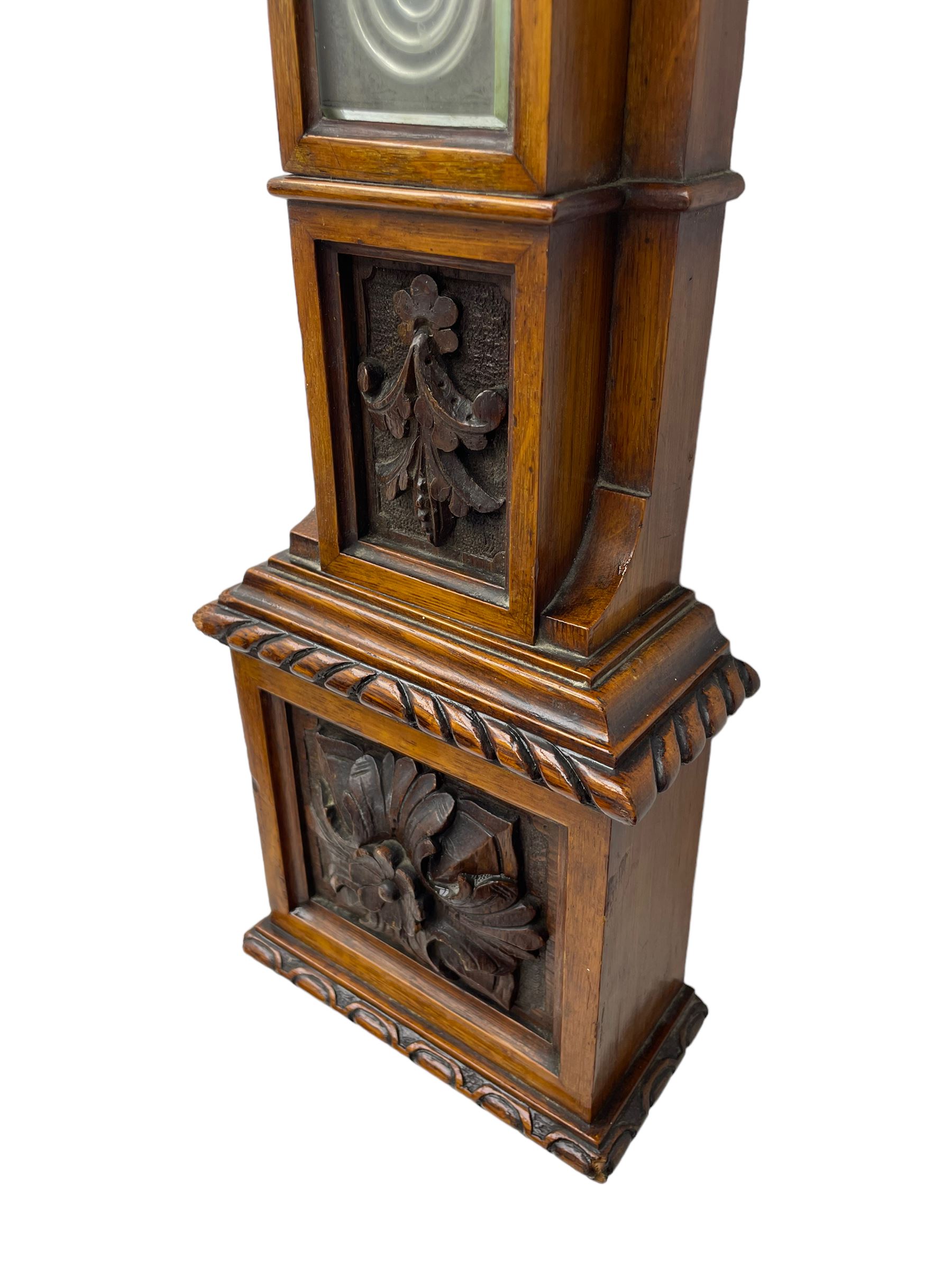 J Hicks - Hatton Garden London, - late 19th century carved oak cased Fitzroy barometer in a richly carved case with a carved crested pediment and square cistern cover, inverted opaline register reflecting FitzRoy's predictions and a scale from 27 to 31 inches of barometric pressure, with a thick bore cistern tube and adjustable rack and pinion twin vernier, fitted with a glazed snail bulb mercury thermometer recording the air temperature in both Fahrenheit and Celsius. Mercury clean and present.
James Joseph Hicks was born in Ireland, however, early in his life he moved to London where he was apprenticed to the instrument maker Louis P Casella. In 1860 he went into business in his own right as a scientific instrument maker at 8 Hatton Gardens. In 1864 he was granted membership to the British Meteorological Society and exhibited instruments at the Royal Society Exhibitions between 1876 and 1913. Hicks was one of London's most prolific and eminent barometer makers. 