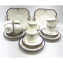 Shelley teawares, decorated in the 11422 pattern, comprising seven cups, twelve saucers, twelve plates, milk jug, slop bowl and two cake plates. 