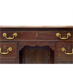 George III mahogany kneehole desk, moulded rectangular top over one long drawer and six smaller drawers, the recessed cupboard with shaped apron enclosed by rectangular door, on bracket feet