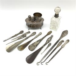 Group of silver comprising a 1928's jewellery box of oval form with cabriole legs, hallmarked Alfred Deeley Birmingham 1923, napkin ring with engine turned decoration, Alfred Deeley Birmingham 1949, collection of assorted silver handled button hooks and shoe horns, various hallmarks, silver collared glass dressing table bottle, two silver thimbles 