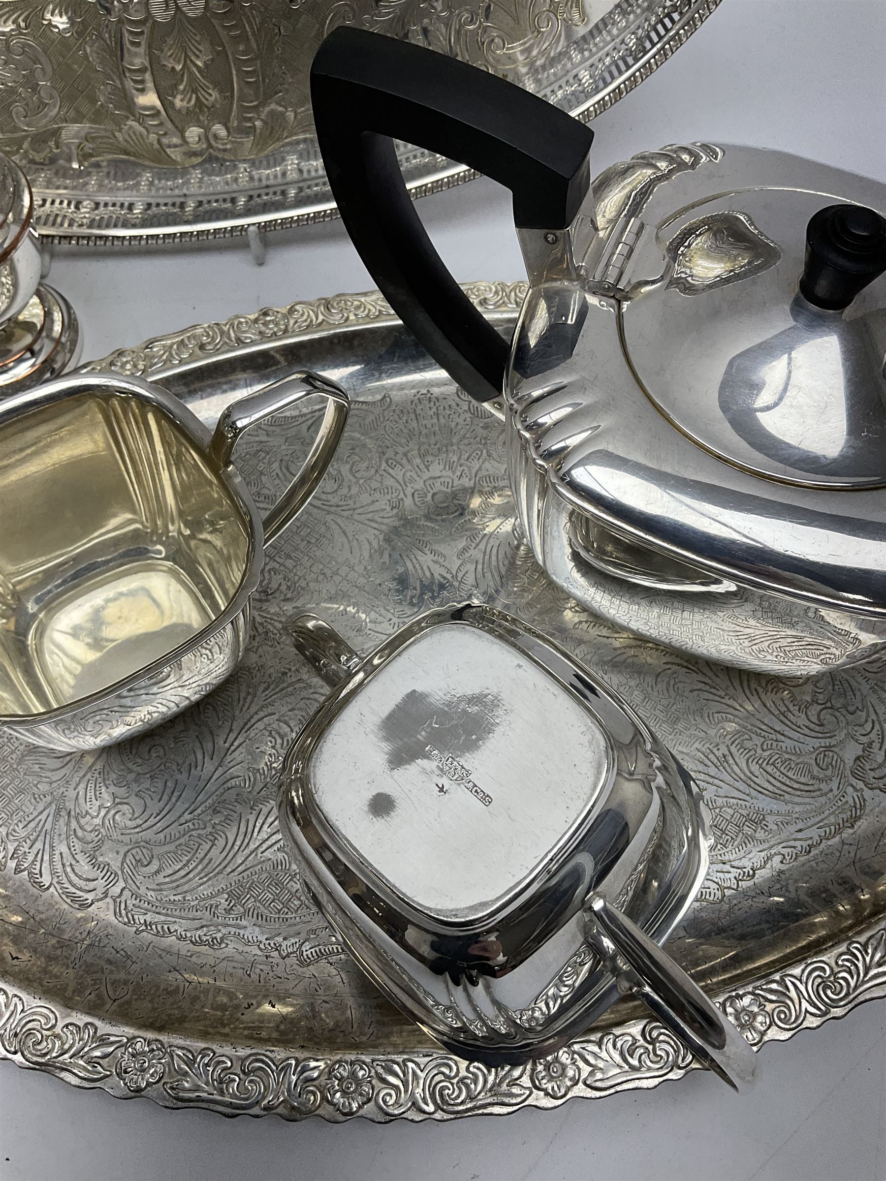 Silver plated tea set by H Fisher & Co of Sheffield comprising tea pot, open sucrier and milk jug, Viners of Sheffield 'Chased' tray, Onedian USA silver plated tea and coffee pots with lidded sucrier and jug, and other plated and similar items