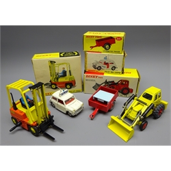  Four Dinky models: Conveyancer Fork Lift Truck No.404, Muir Hill 2-WL Loader No.437, Police Mini Cooper No.250 and Land-Rover Trailer No.341, all boxed  