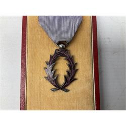 Five continental medals - WW1 Belgian Cross of Fire; WW1 French Croix De Guerre; French Croix De Combattant; French Republic Workers silver merit awarded to L. Mounet 1950; and boxed French Palmes Universitaires Officier d'Academie silver and enamel wreath (5)