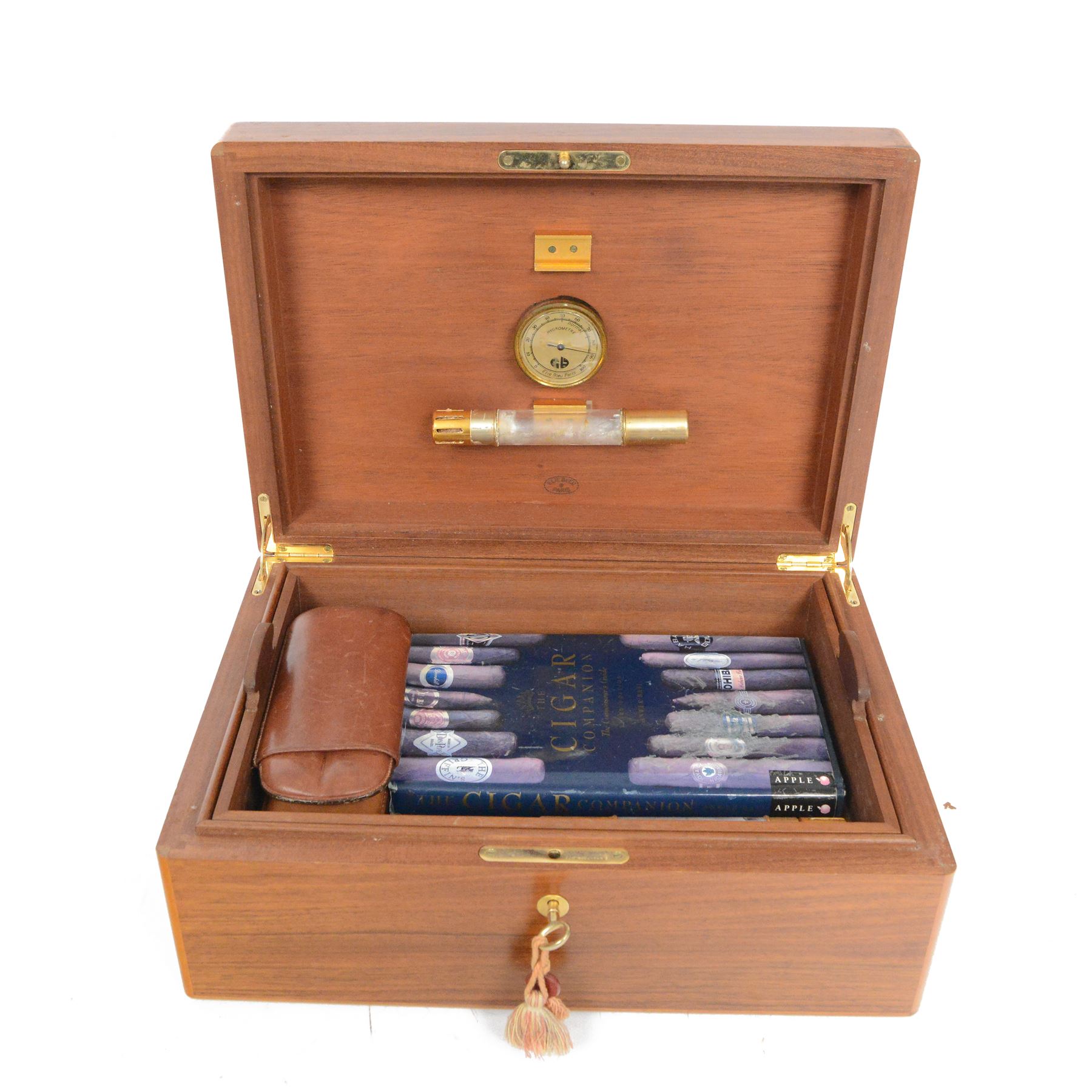 Elie Bleu of Paris, mahogany humidor with partitioned interior and inset hygrometer, together with two cigar cases and The Cigar Companion book