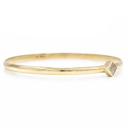 18ct gold fancy champagne / brown diamond bangle, bezel set with a single princess cut diamond of approx 0.70 carat, stamped 750