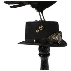 Taxidermy: Carrion Crow (Corvus corone), perched upon a steampunk hat, with wings open, H94cm