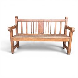 20th century teak cricket bench featuring a central splat with moulded cricket bat and ball motif flanked by stylised wicket spindles, over a slatted seat and square supports