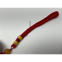 Chinese hardstone carving of a fish amongst coral, with platted rope handle, together with other hardstone and soft stone carvings  