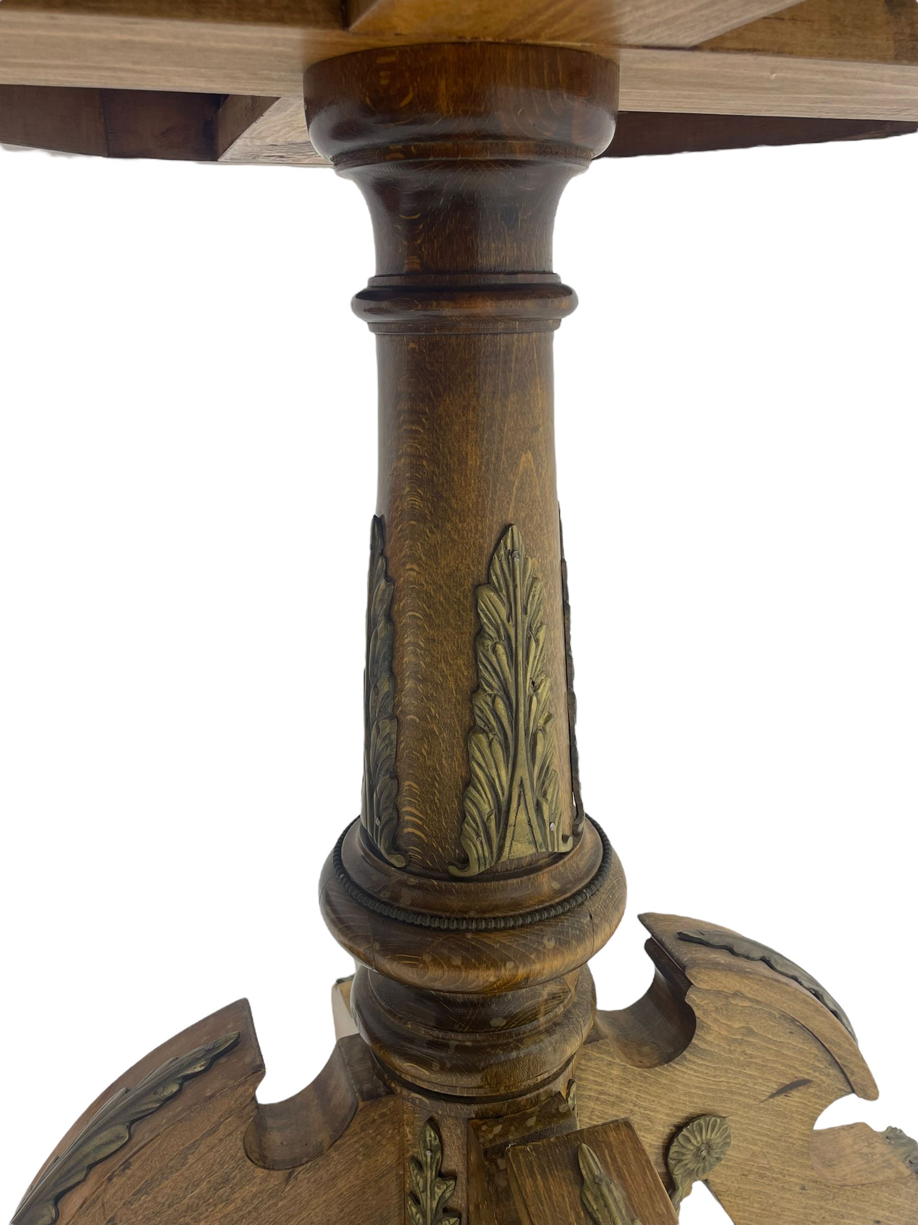 Mid-20th century figured walnut Italian design centre table, octagonal quarter veneered top with cross banding and moulded edge, the skirt decorated with scrolling foliage gilt metal mounts, on turned pedestal mounted with gilt acanthus leaves, quadruple splayed supports with further acanthus leaf decoration