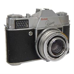 Kodak Retina Reflex camera outfit, comprising camera body serial no. EK 83509, six Schneider-Kreuznach lenses including Retina-Xenon f:2.0/50mm, Retina-Tele-Xenar f:4/135mm, Retina-Curtagon f:4/28mm and Retina-Longar-Xenon f:4/80mm, Retina-Curtar-Xenon f:4/35mm, Retina-Curtar-Xenon f:5.6/35mm, filters, platform and hood, contained within a tan Rowi carry case