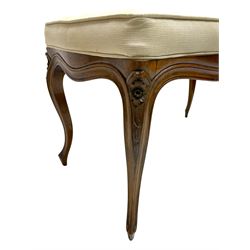 20th century French walnut stool, shaped rectangular seat upholstered in pale fabric, floral carved cabriole supports with scrolled terminals
