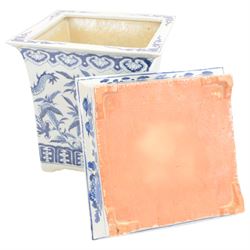 Chinese blue and white planter and stand, each of square slightly tapering and flared form, the planter decorated with two dragons and blossoming peonies, between stylised borders, the stand decorated with flower heads and vines, planter H30cm W29cm, stand H7cm D28.5cm