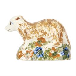 Late 18th/early 19th century Staffordshire model of a fox, the stalking fox decorated in Pratt type colours upon a green grassy mound base detailed with blue and ochre flowers, bearing Jonathan Horne labels beneath, H5.5cm L9cm

