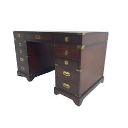 Military style mahogany twin pedestal desk, rectangular top with green inset, fitted with eleven drawers, recessed brass handles and brackets, on bracket feet