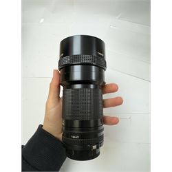 Canon F-1 SLR camera body serial no. 300461, boxed, together with thirteen Canon camera lenses, mostly FD, including 300mm 1:4 serial no. 18864, 100-300mm 1:5.6 serial no. 24187 and 200mm 1:2.8 serial no 16443, and three boxed FD extension tubes, some boxed