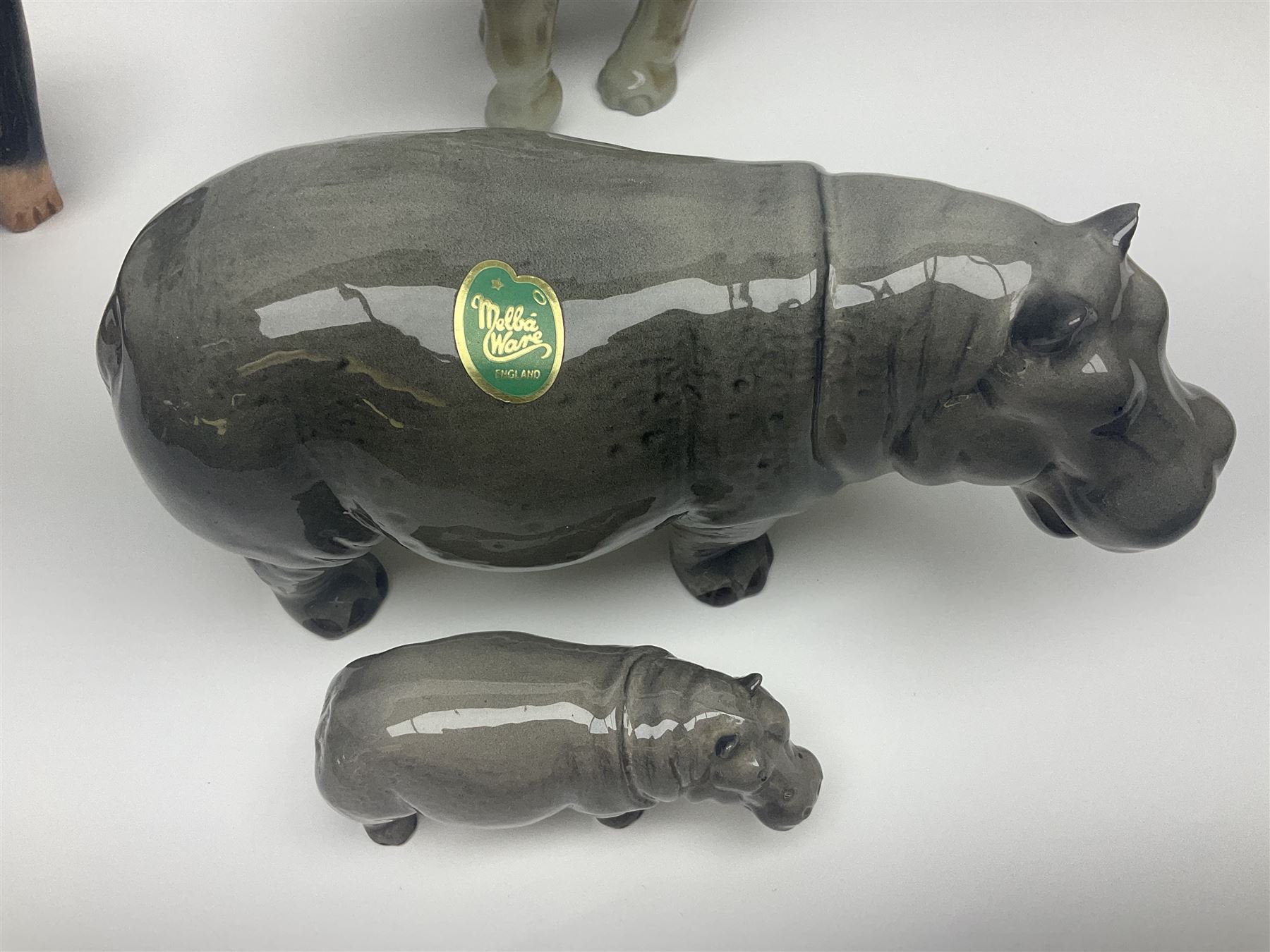 Large Sylvac monkey together with three smaller monkeys, together with Beswick Pigeon no 1383, Melba Ware hippo and baby and Royal Dux elephant 